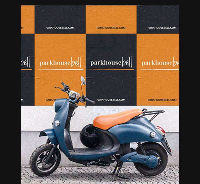 A moped in front of Parkhouse Bell posters